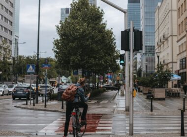 a person riding a bicycle on a city street